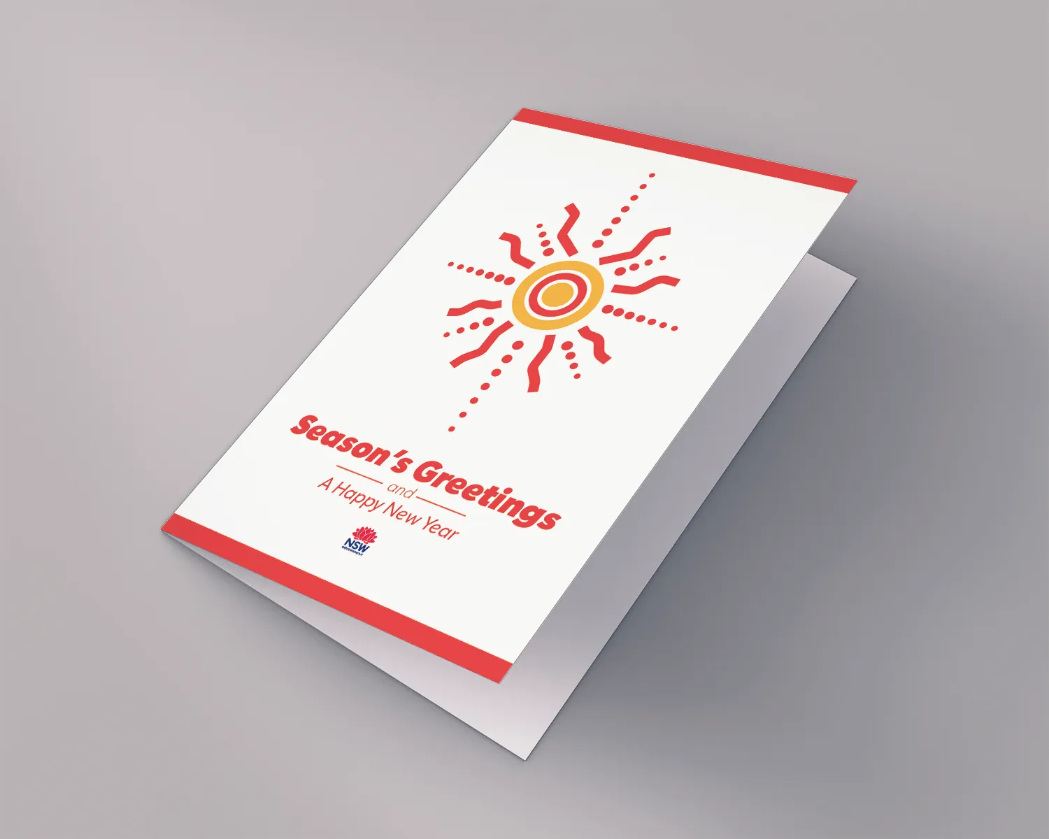 'Season's Greetings' card mockup with a red and gold sun motif on white
