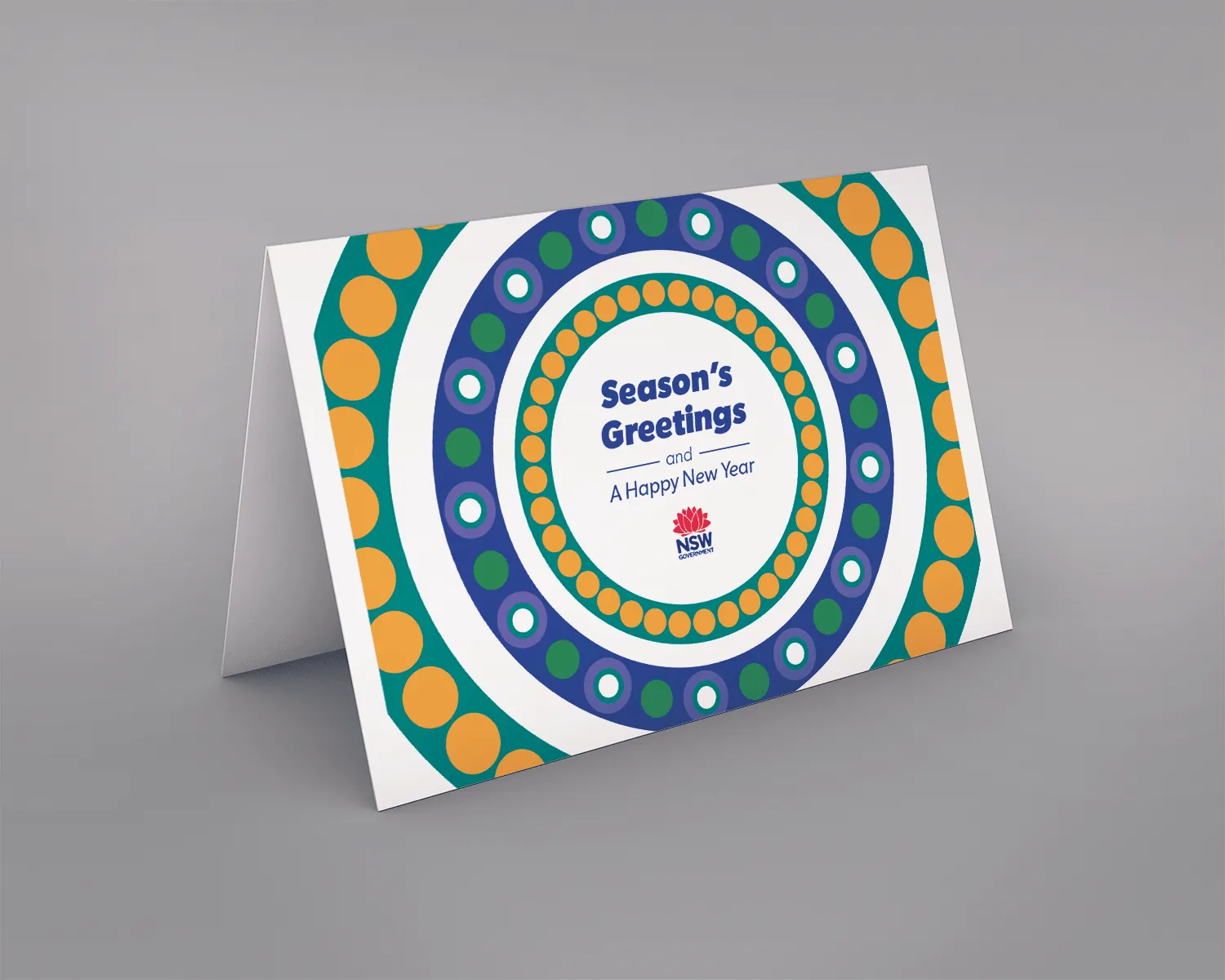 'Season's Greetings' card mockup with concentric dot-pattern circles in teal, orange, blue and green